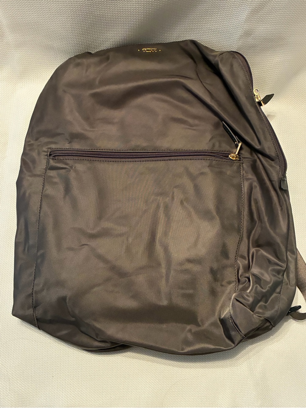 Tumi Black Nylon Backpack with Gold Accents